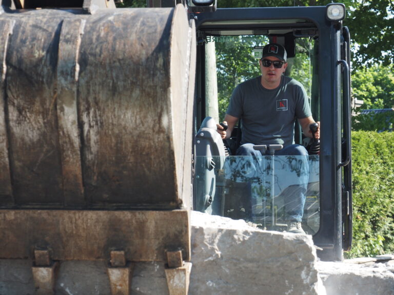 Man operating excavator in Kawartha Lakes